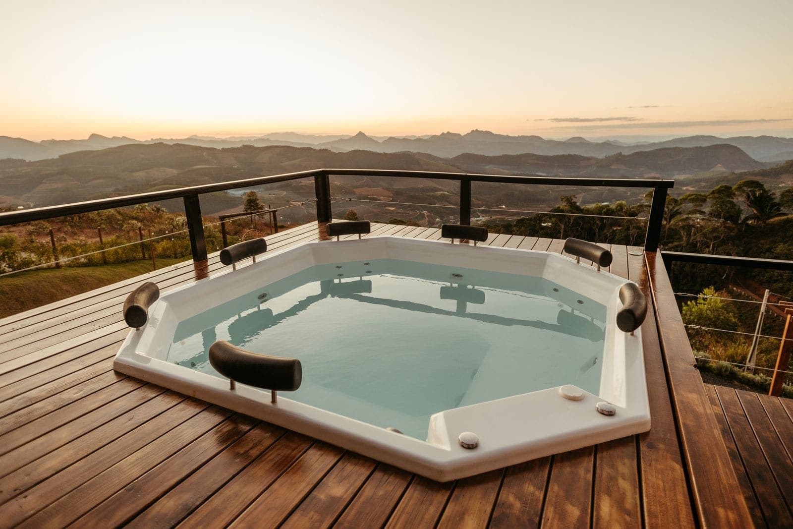 Spa set into a timber deck with an open view beyond
